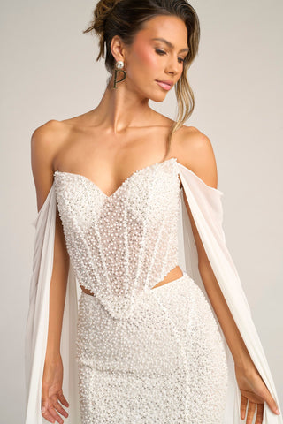 White beaded corset gown with cape sleeves