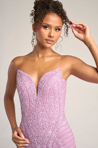 Lavender beaded strapless gown on woman