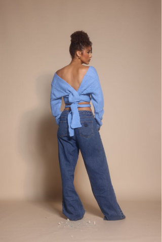 Woman in blue top and jeans, screenshot from Oct 30, 2025.