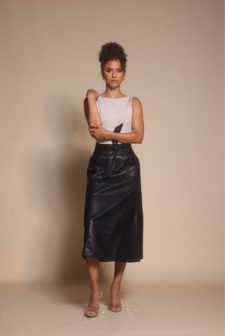 Screenshot of woman in leather skirt, Oct 30, 2025