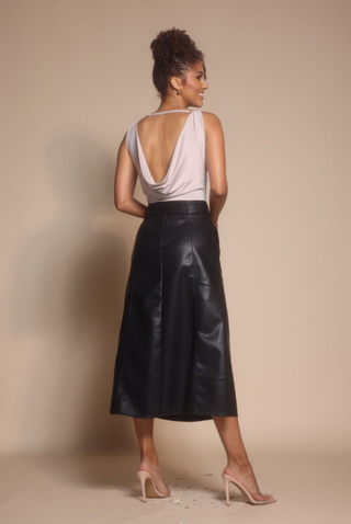 Woman in leather skirt, screenshot from Oct 30, 2025.