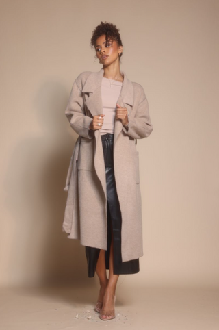 Woman in coat, screenshot Oct 30, 2025