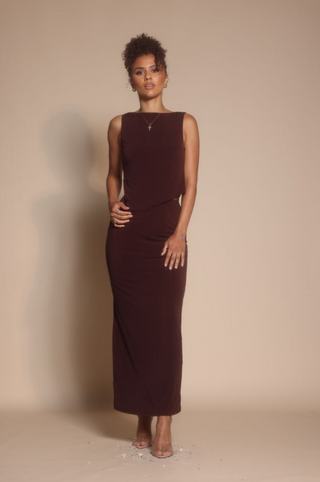 Woman in burgundy dress, screenshot Oct 30, 2025