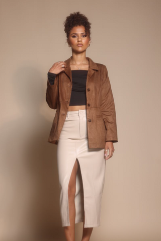 Woman in brown blazer and skirt, Oct 30, 2025 screenshot.