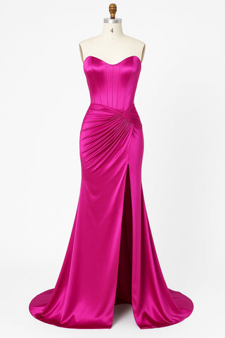 Hot pink strapless evening gown with high slit.