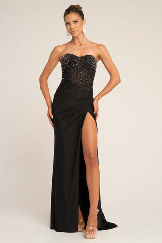 Black strapless beaded gown with thigh slit.