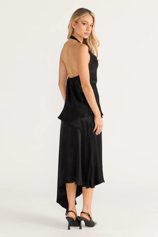 Bianca in black halter dress, side view