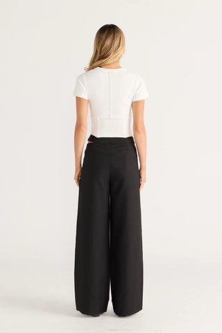 White corset top and black palazzo pants, view 1 of 4.