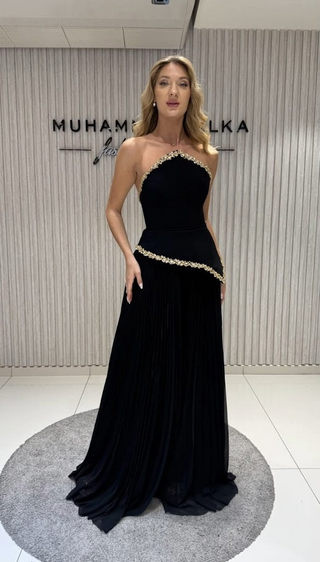 Woman in a black evening gown.