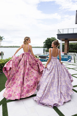 Two women in floral ball gowns