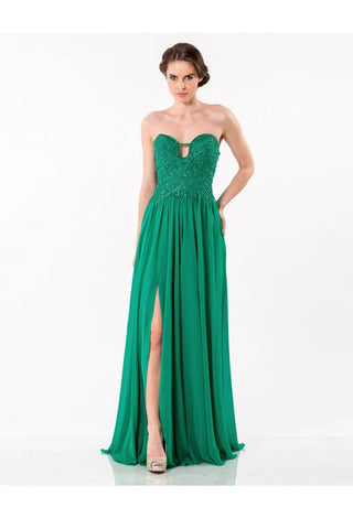 Woman in a green strapless gown with a high slit.