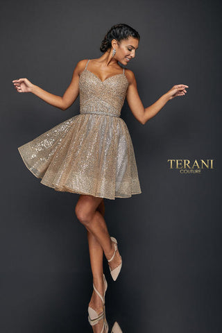 Glittery gold cocktail dress on model.