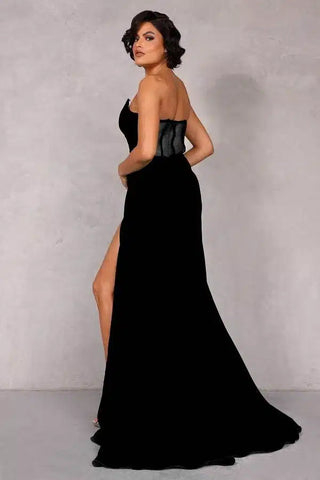 Black strapless gown with thigh-high slit, back view.