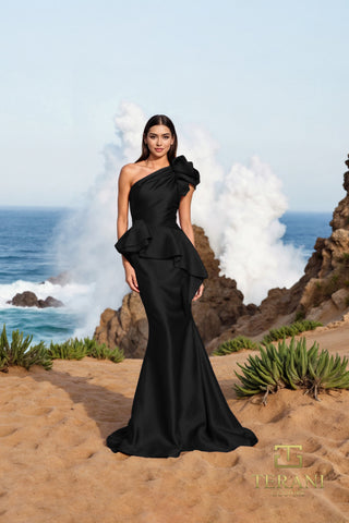 Black one-shoulder gown by the sea