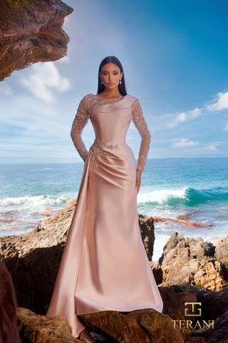 Blush gown on woman by ocean