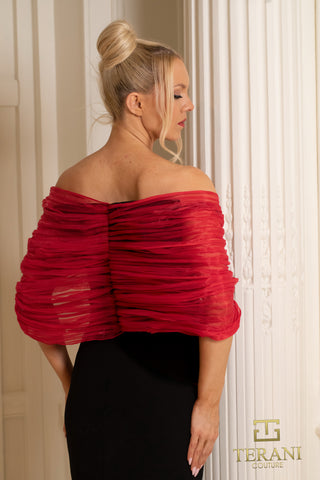 Woman in black dress and red shawl