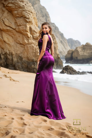 Woman in plum dress on beach