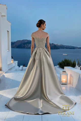 Taupe satin gown with train, overlooking sea