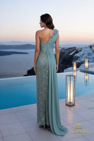 Elegant teal one-shoulder gown with lace detail, Santorini view