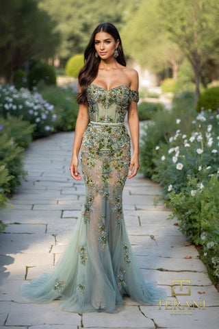 Woman in green embellished gown, front view