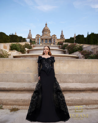 Black gown in front of Barcelona landmark