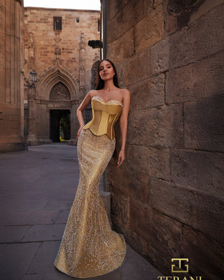 Woman in gold formal gown.
