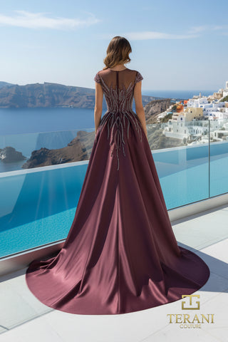Wine-colored gown with embellishments overlooking water