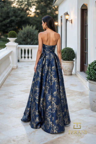 Bluestone gown in navy and gold with outdoor backdrop