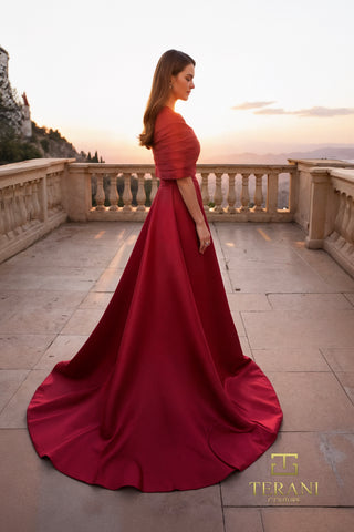 Woman in red wine gown with shawl