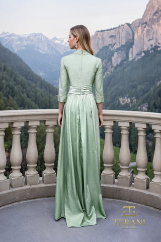 Sage green Terani gown with mountains in background