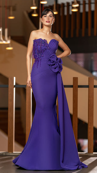 Woman in a purple strapless gown.