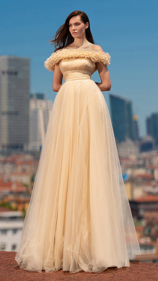 Woman in formal gown, cityscape background.