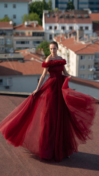 Woman in red off-shoulder gown 6154bo-2, rooftop view