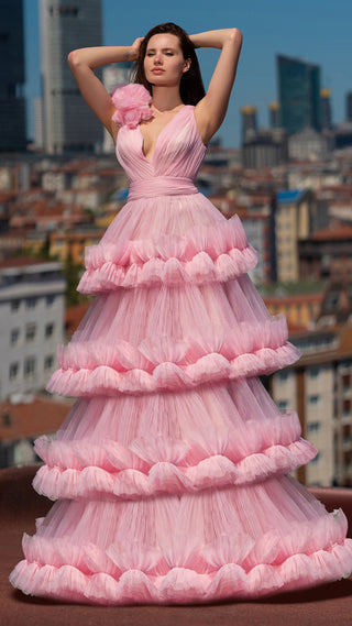 Woman in pink tiered gown.