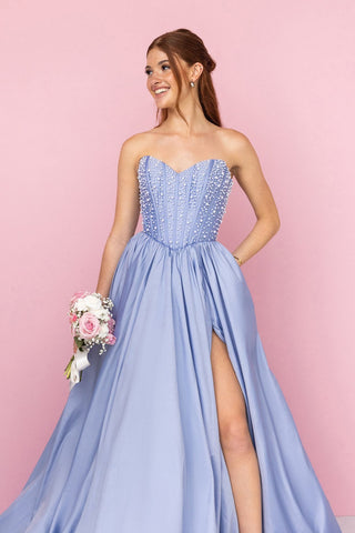 Woman in blue formal dress with thigh slit, CTxFt9Jw
