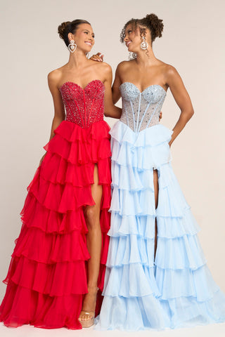 Two women in red and blue ruffled formal gowns.