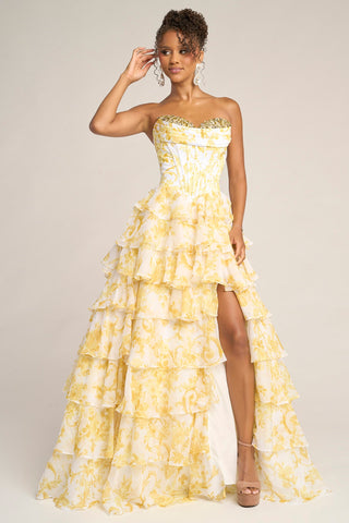 Yellow floral strapless gown with high slit.