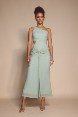 Woman in mint green one-shoulder dress, screenshot from Oct 30, 2025.