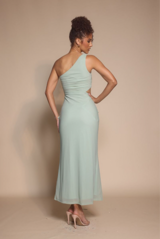 Woman in sage green one-shoulder dress, screenshot Oct 30, 2025