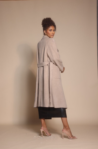 Woman in coat, screenshot Oct 30, 2025