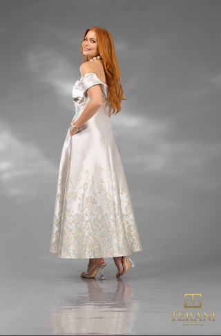 Woman in off-the-shoulder dress, screenshot Nov 11, 2025