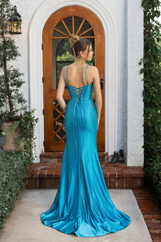 Turquoise formal gown, XO070, standing in front of door.