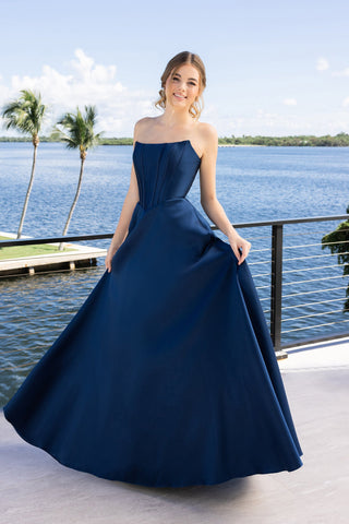 Navy blue formal gown XO124 on woman by the water.