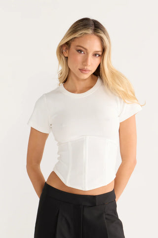 Woman wearing white corset top