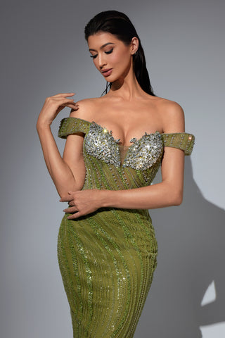 Woman in green sequin gown