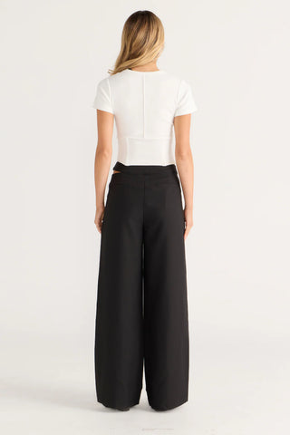 Black wide-leg pants and white top