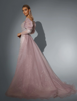 Woman in a long, lavender gown with a train.