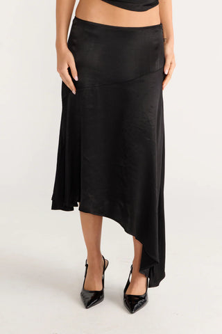 Julia's black asymmetrical skirt and heels